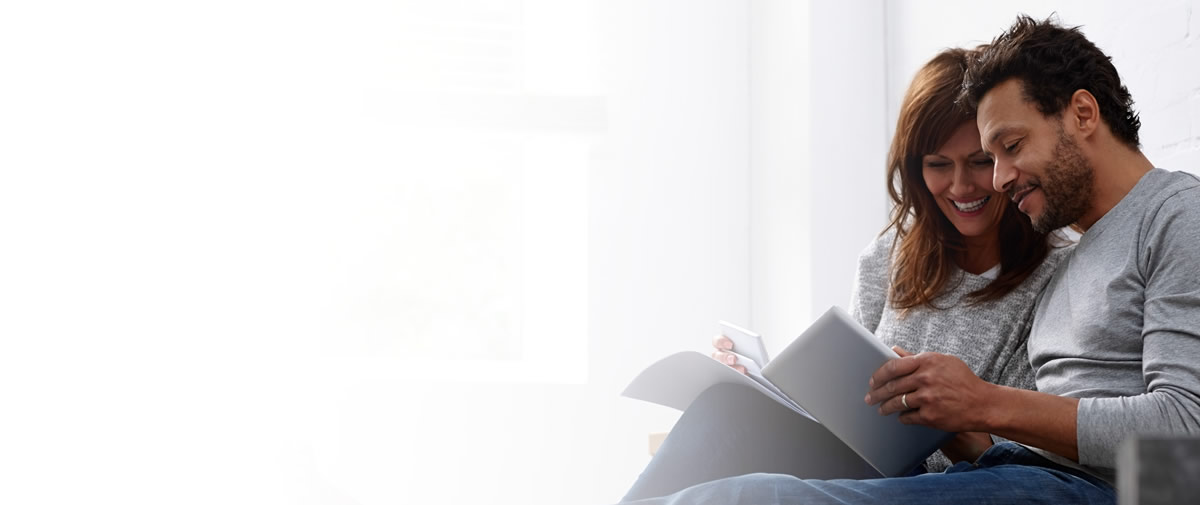 Property investors reviewing acquisition yield analytics on a digital tablet